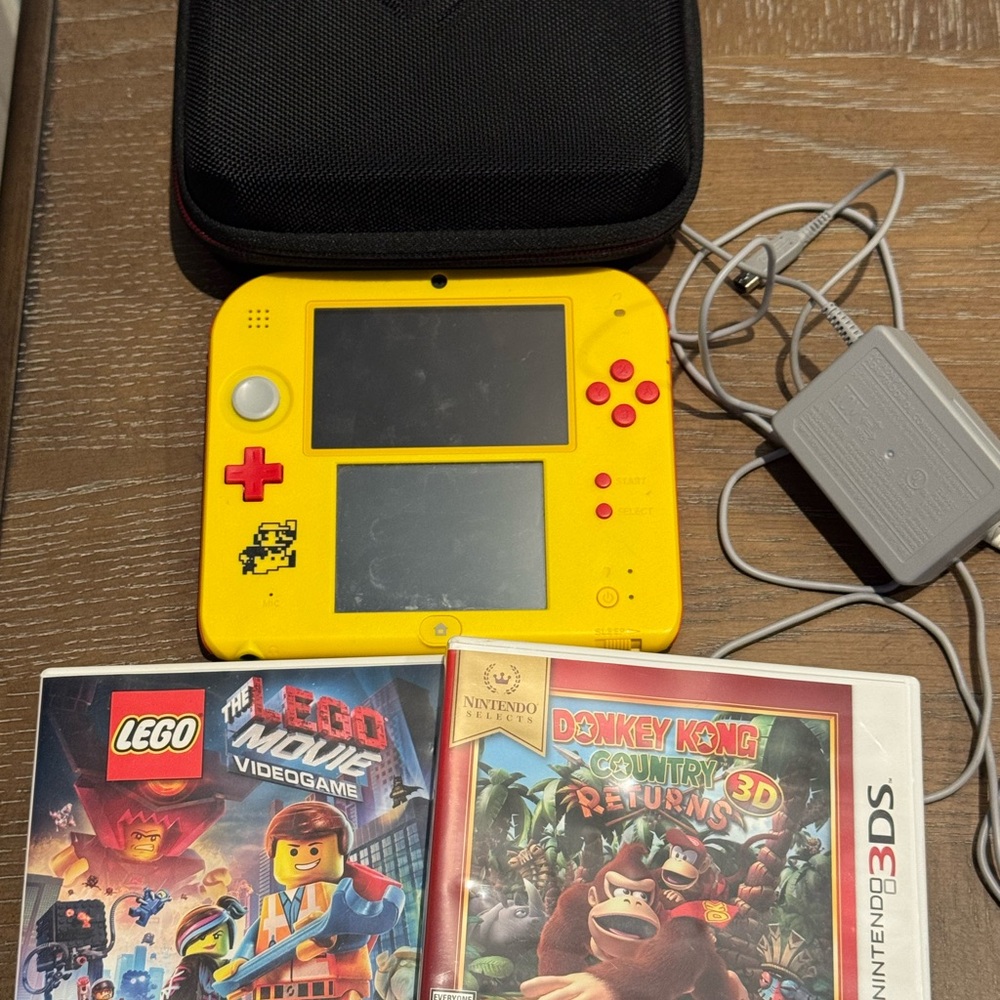 Nintendo Yellow 2DS Handheld with Red Buttons and White Stick